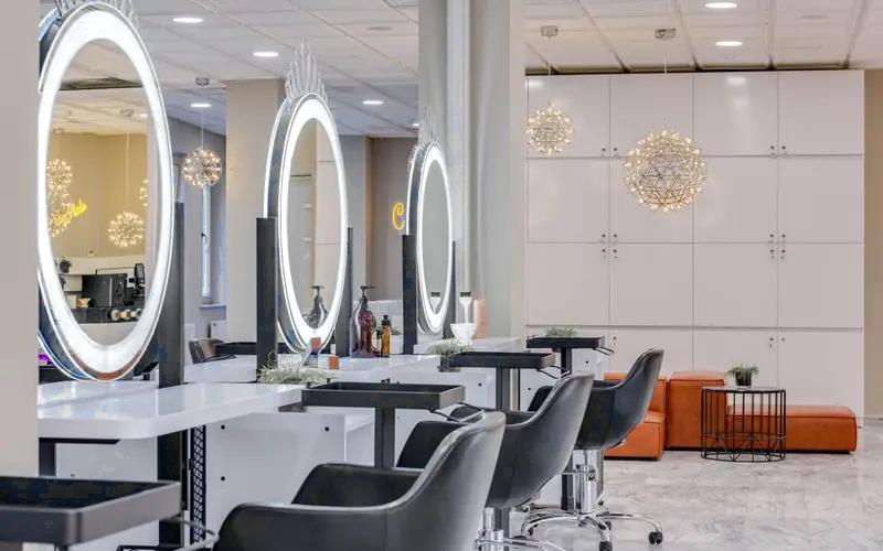 Bright salon interior with chairs and round mirrors (illustrative image, not the business for sale)
